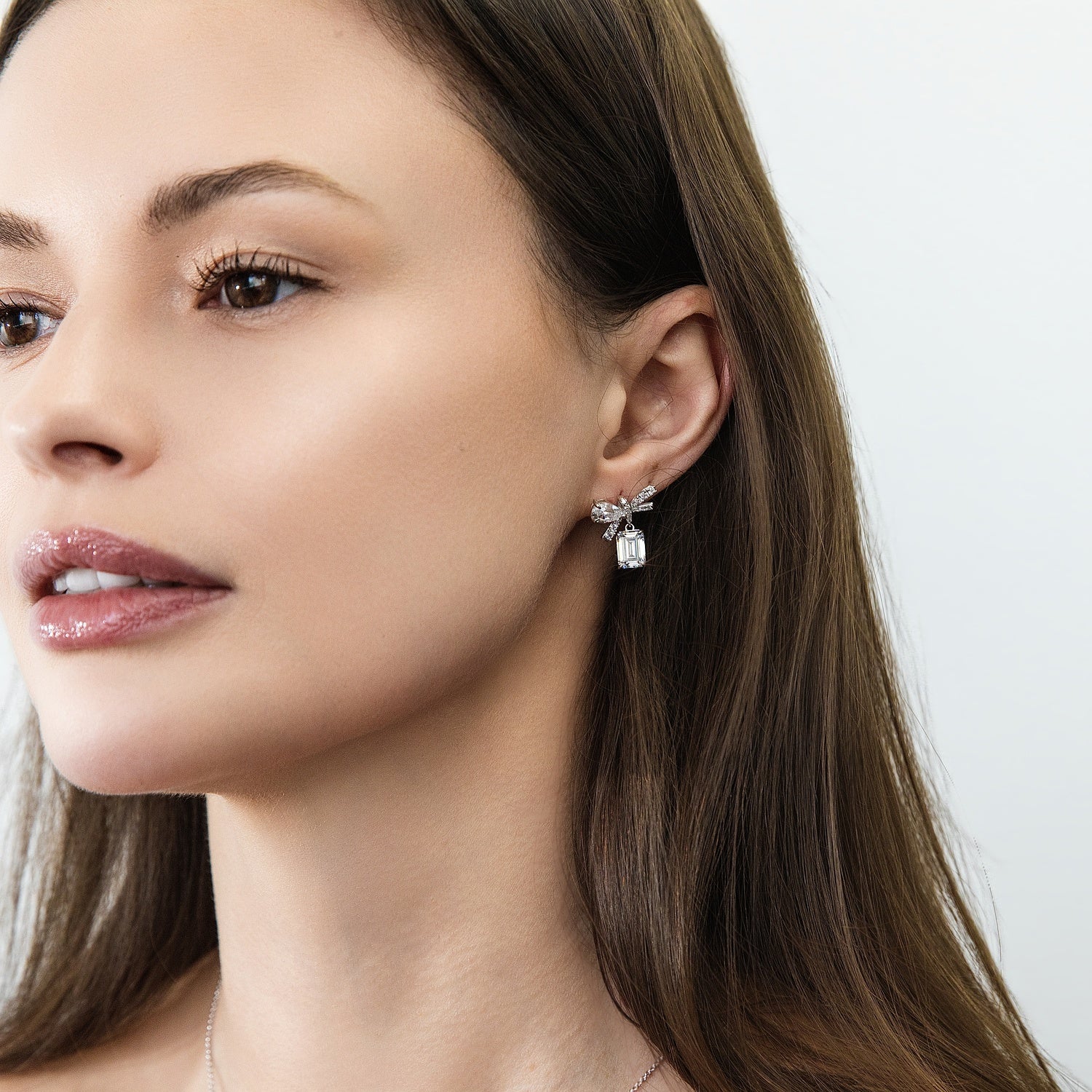 Model wearing Bow Tie Ribbon CZ Set in Sterling Silver, 9 of 11