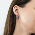 Model wearing Snake CZ Stud Earrings in Sterling Silver, Rhodium Plated