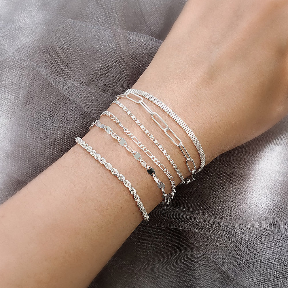 Model wearing Figaro Chain Bracelet in Sterling Silver, Yellow Gold Flashed