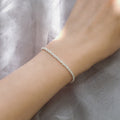 Model wearing Twisted Rope Chain Bracelet in Sterling Silver 3mm, Yellow Gold Flashed
