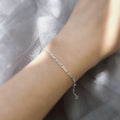 Model wearing Figaro Chain Bracelet in Sterling Silver, Yellow Gold Flashed