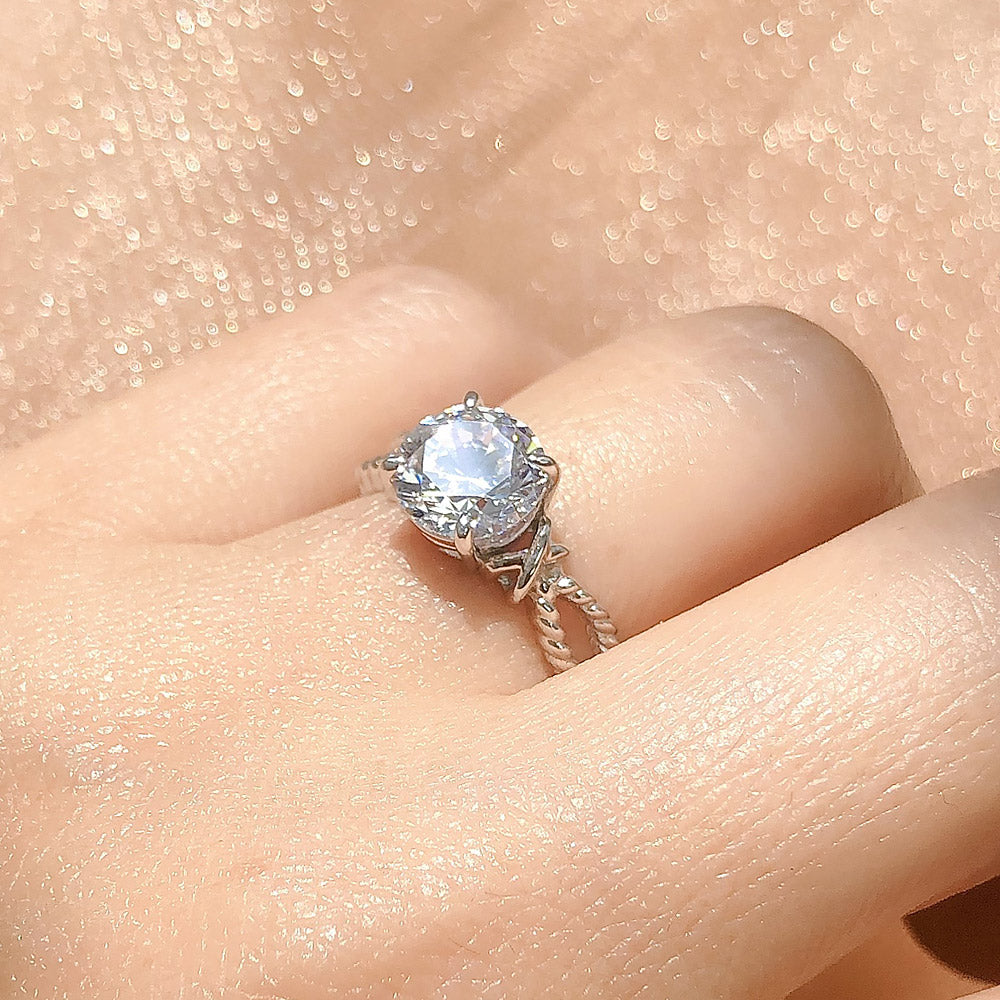 Model wearing Cable Woven Solitaire 2ct CZ Ring in Sterling Silver, 9 of 12