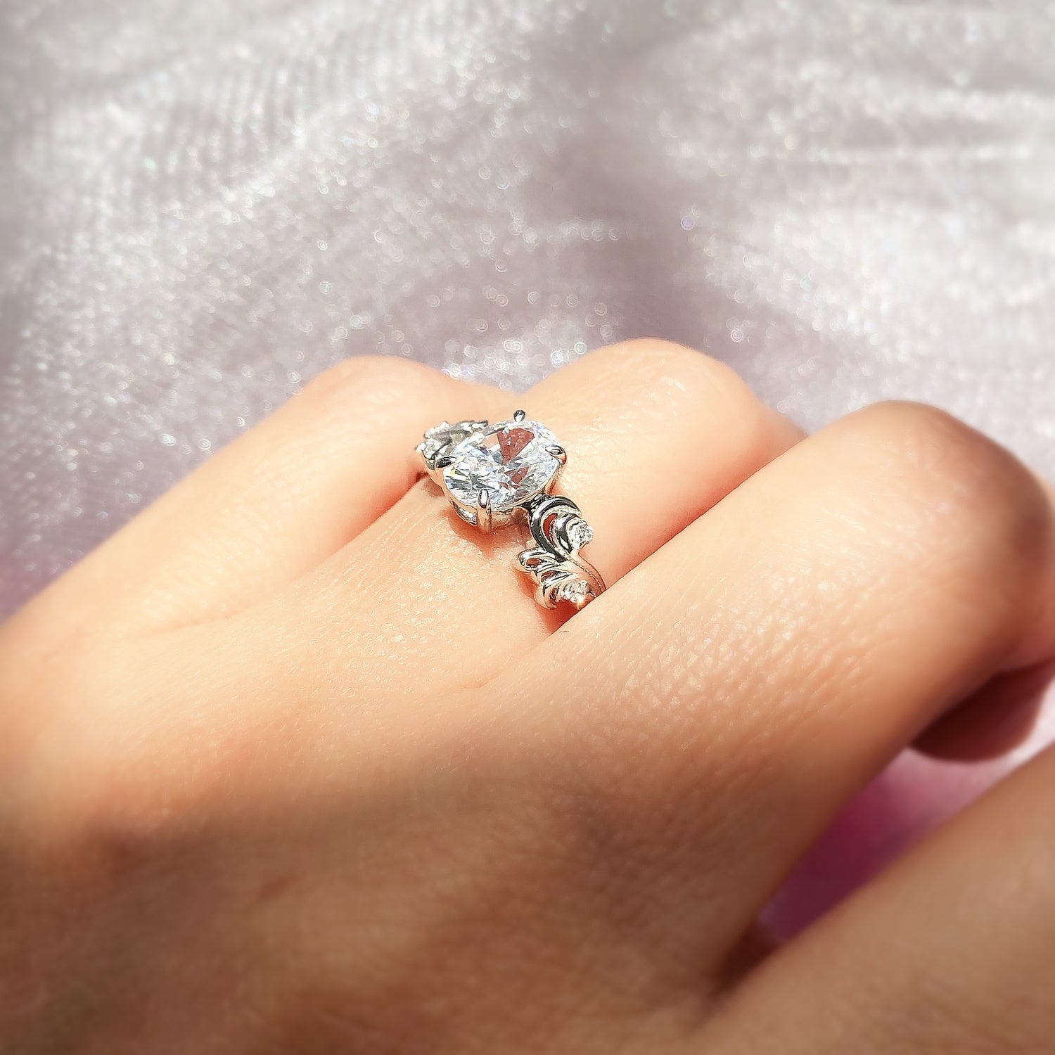 Model wearing Solitaire Filigree Flower 1.2ct Oval CZ Ring in Sterling Silver, 3 of 7