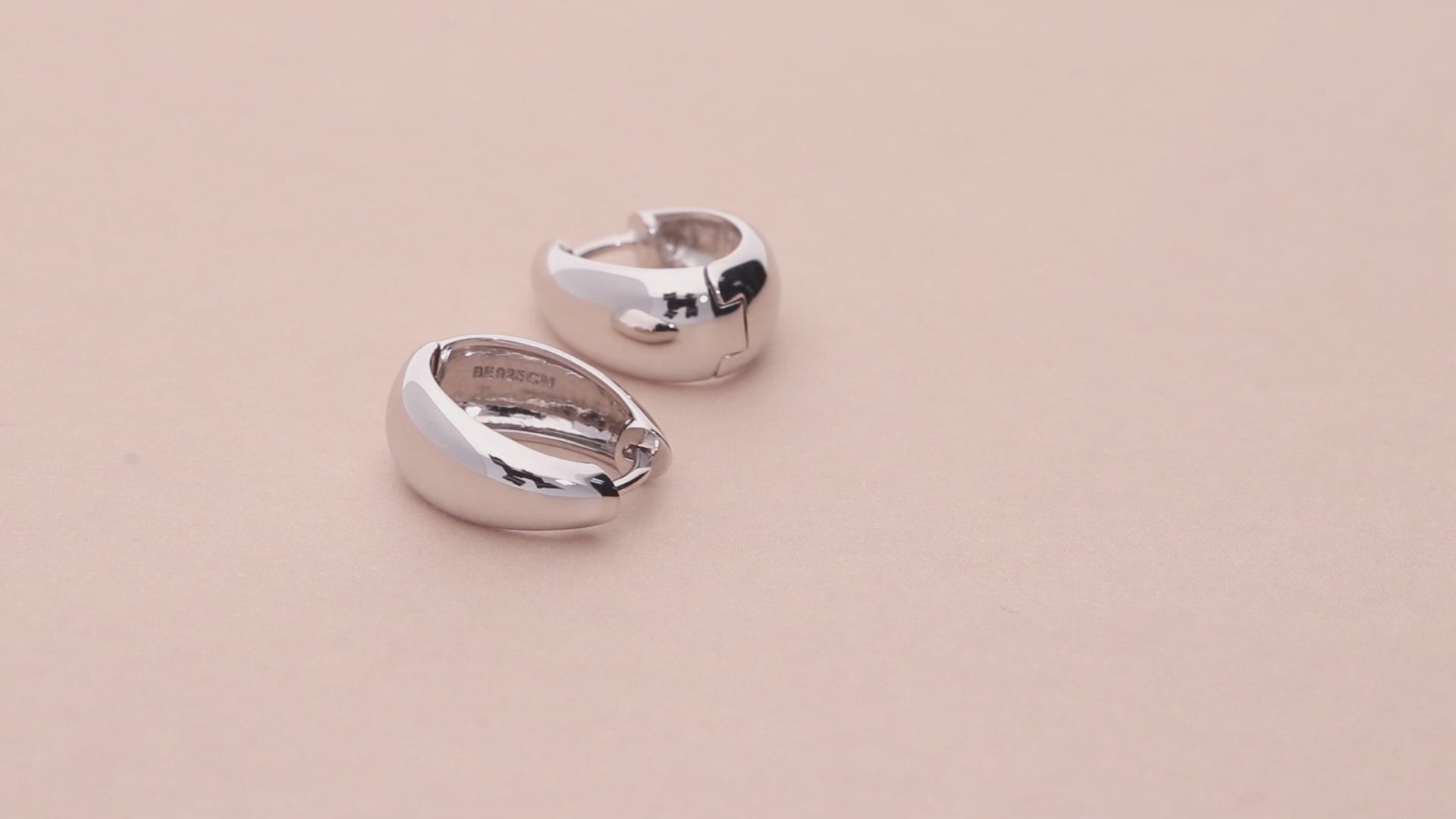 Video Contains Oval Dome Medium Huggie Earrings in Sterling Silver 0.63". Style Number E1705
