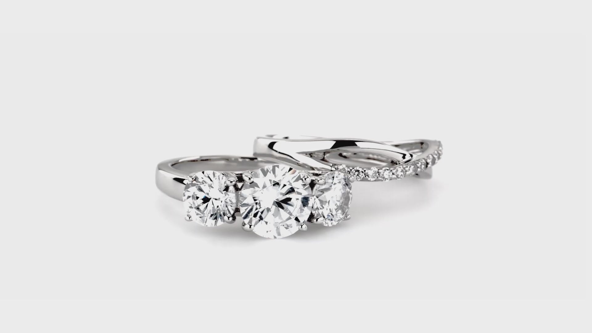 Video Contains 3-Stone Criss Cross Round CZ Ring Set in Sterling Silver. Style Number VR193-01