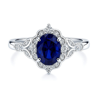Halo Art Deco Sapphire-Blue Oval CZ Ring in Sterling Silver