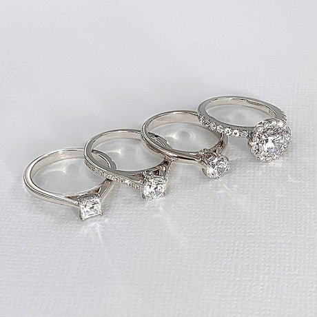 Image Contain: Halo Ring, Ring, Solitaire Ring, Solitaire with Side Stones Ring
