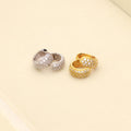 Flatlay view of Dome CZ Mini Huggie Earrings in Sterling Silver 0.5 inch