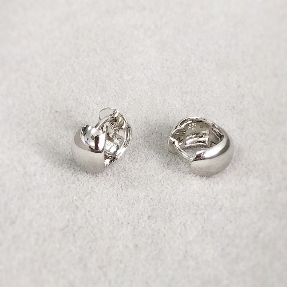 Flatlay view of Dome Mini Huggie Earrings in Sterling Silver 0.45 inch, 10 of 12