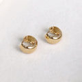 Flatlay view of Dome Mini Huggie Earrings in Sterling Silver 0.5 inch, Gold Flashed