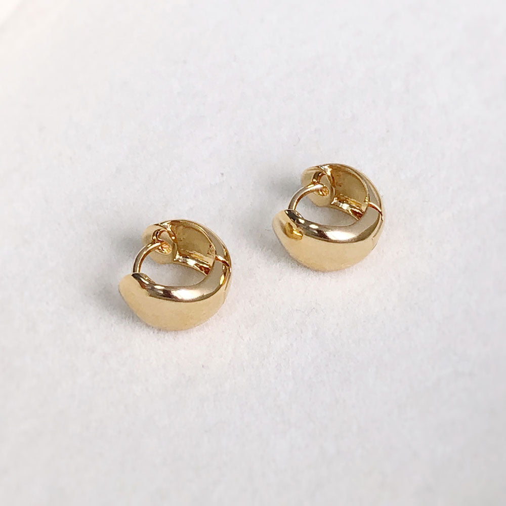 Flatlay view of Dome Huggie Earrings in Gold Flashed Sterling Silver, 2 Pairs, 11 of 15