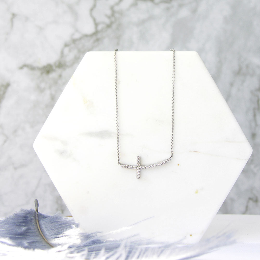 Flatlay view of Sideways Cross CZ Pendant Necklace in Sterling Silver, 6 of 9