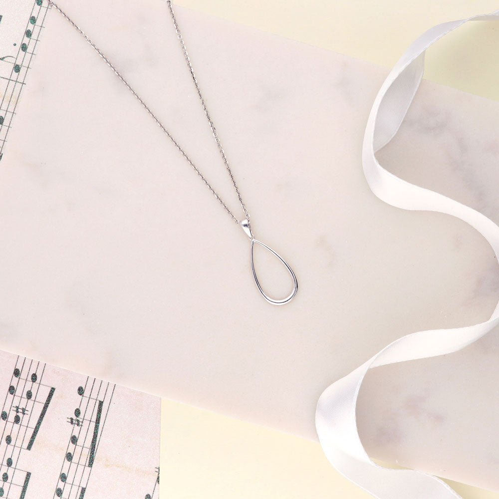 Flatlay view of Teardrop Necklace and Earrings in Sterling Silver, 10 of 12