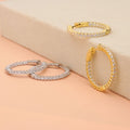 Flatlay view of CZ Small Inside-Out Hoop Earrings in Sterling Silver 1 inch