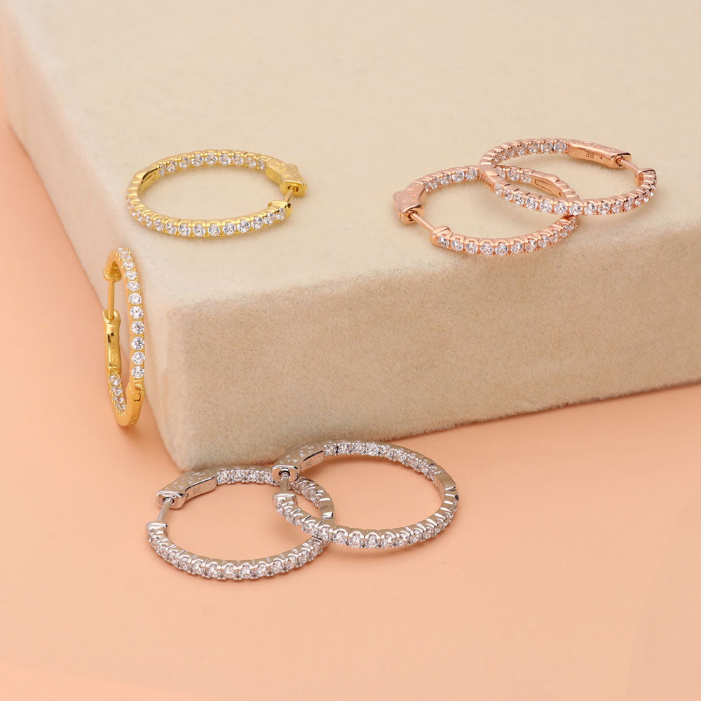 Flatlay view of CZ Small Inside-Out Hoop Earrings in Sterling Silver 1 inch
