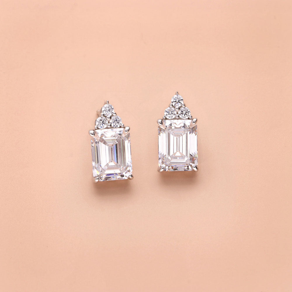 Flatlay view of Solitaire 4.2ct Emerald Cut CZ Stud Earrings in Sterling Silver, 6 of 8