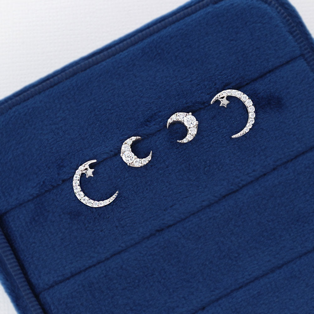 Flatlay view of Crescent Moon CZ Stud Earrings in Sterling Silver, 7 of 10
