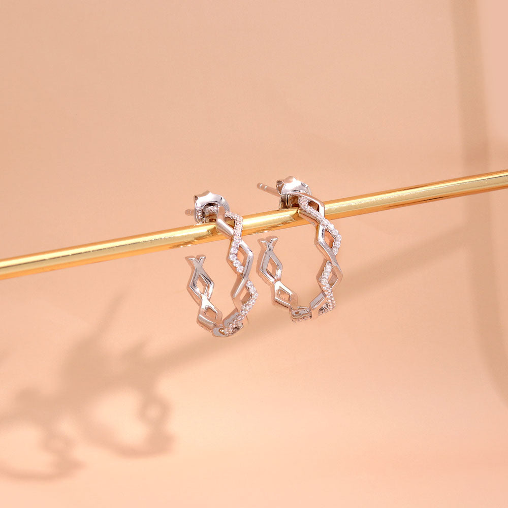Flatlay view of Woven CZ Small Hoop Earrings in Sterling Silver 0.8 inch, Yellow Gold Flashed