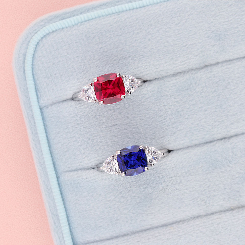 Flatlay view of 3-Stone 3ct Sapphire-Blue Cushion CZ Ring in Sterling Silver, 11 of 12
