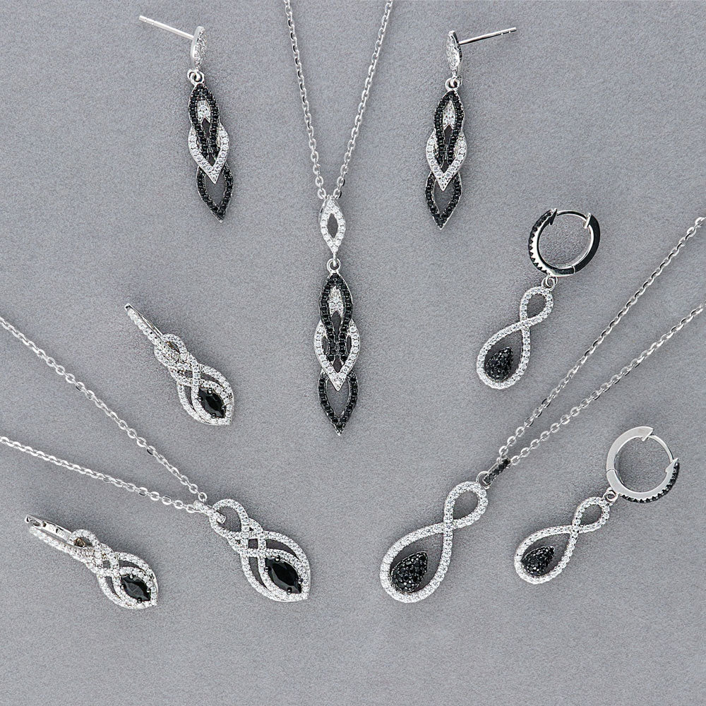 Flatlay view of Black and White Infinity Black CZ Earrings in Sterling Silver, 7 of 9