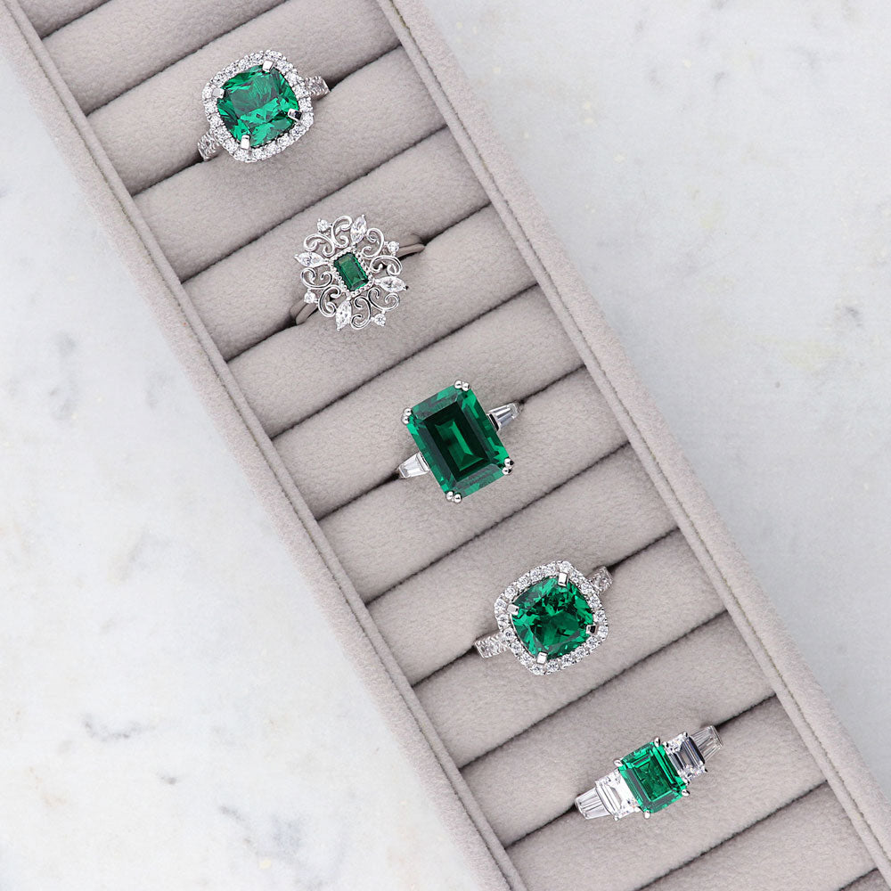Flatlay view of 3-Stone Simulated Emerald Emerald Cut CZ Ring in Sterling Silver, 6 of 8