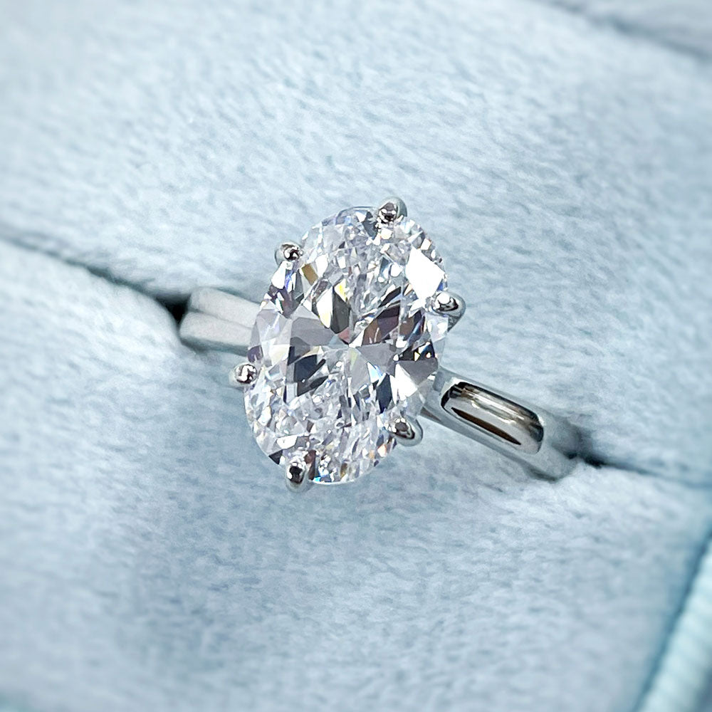 Flatlay view of Solitaire Wishbone 3ct Oval CZ Ring Set in Sterling Silver, 17 of 20