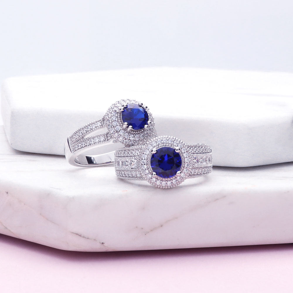 Flatlay view of Halo Milgrain Simulated Blue Sapphire Round CZ Ring in Sterling Silver, 10 of 14