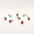 Flatlay view of Solitaire 1.6ct CZ Cartilage Stud Earrings in Sterling Silver, Amethyst Color