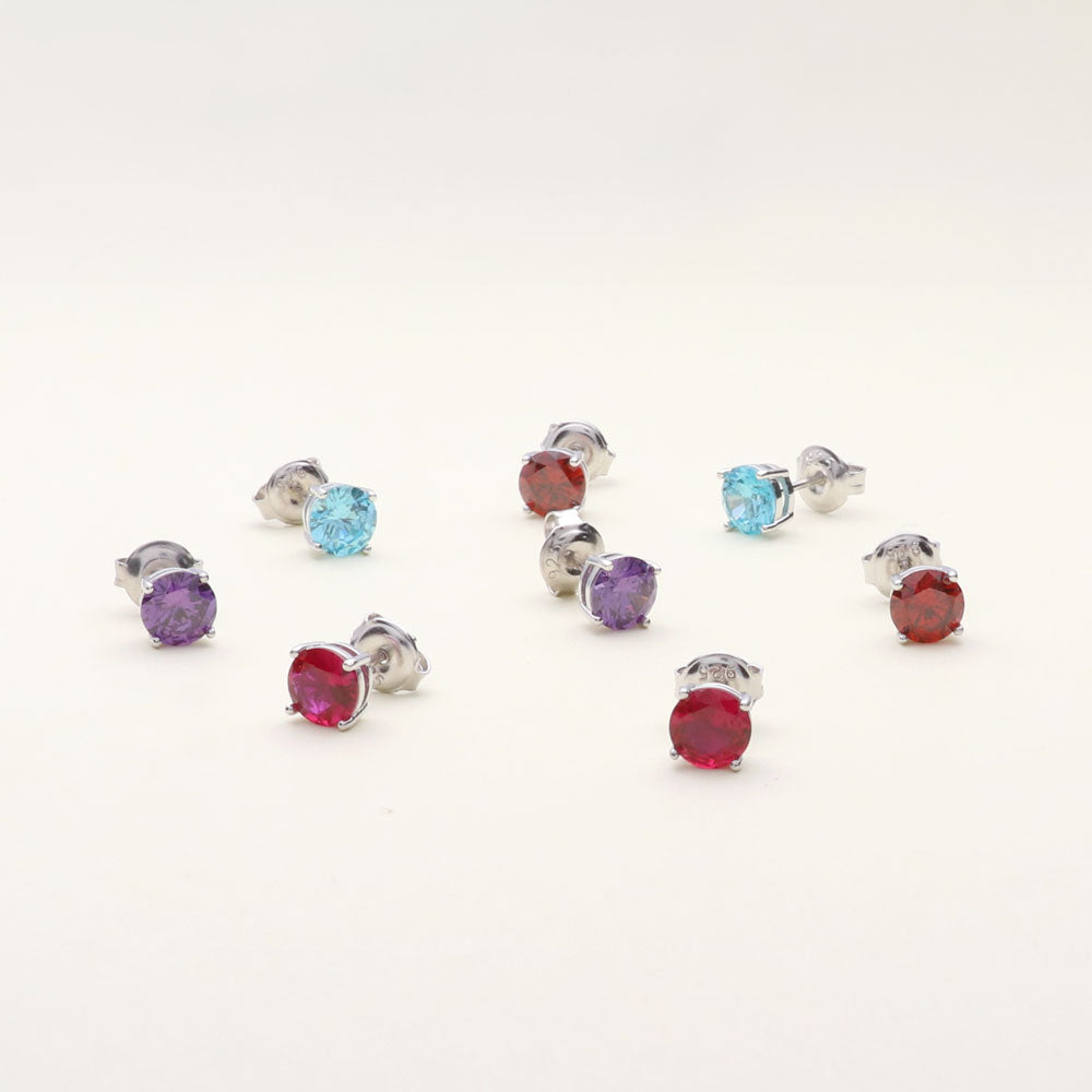 Flatlay view of Solitaire 1.6ct CZ Cartilage Stud Earrings in Sterling Silver, Amethyst Color