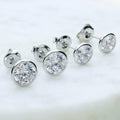 Flatlay view of Solitaire Bezel CZ Stud Earrings in Sterling Silver