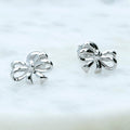 Flatlay view of Bow Tie Ribbon CZ Stud Earrings in Sterling Silver, Style 1