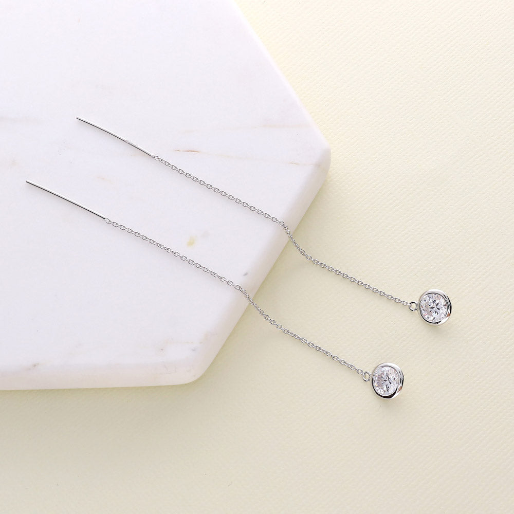 Flatlay view of CZ Threader Earrings in Sterling Silver, Rhodium Plated