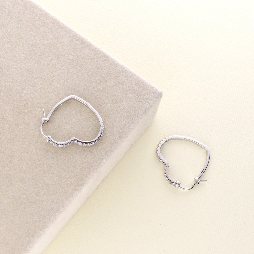 Flatlay view of Heart CZ Small Hoop Earrings in Sterling Silver 1 inch, 5 of 6