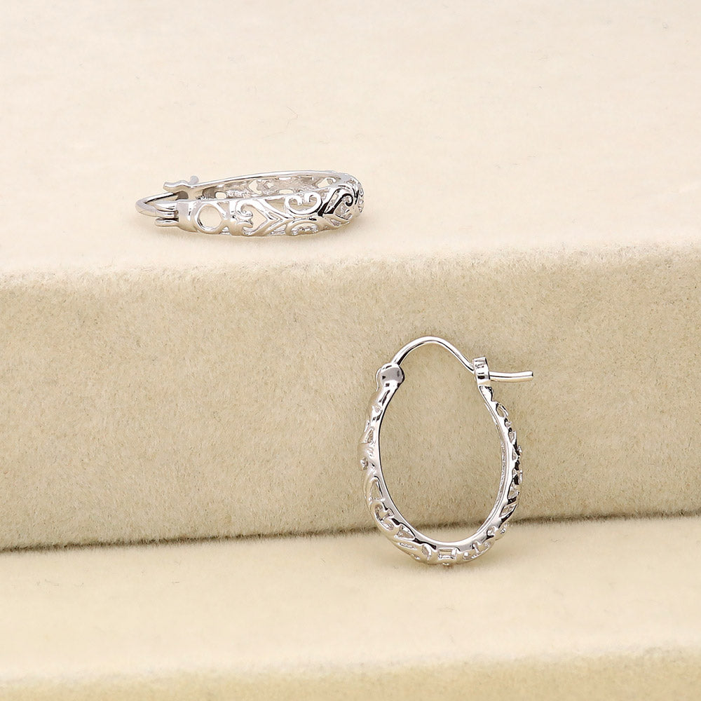 Flatlay view of Oval Filigree Medium Hoop Earrings in Sterling Silver 0.77 inch, 4 of 6