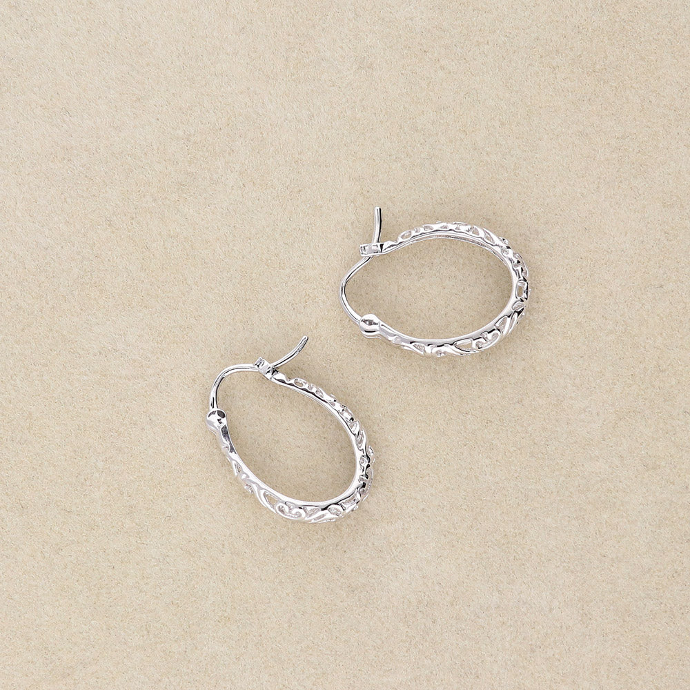 Flatlay view of Oval Filigree Small Hoop Earrings in Sterling Silver 0.8 inch, 3 of 6