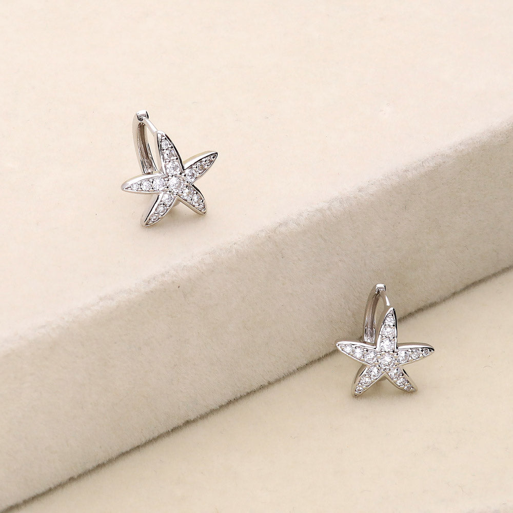 Flatlay view of Starfish CZ Small Huggie Earrings in Sterling Silver 0.5 inch, 3 of 6
