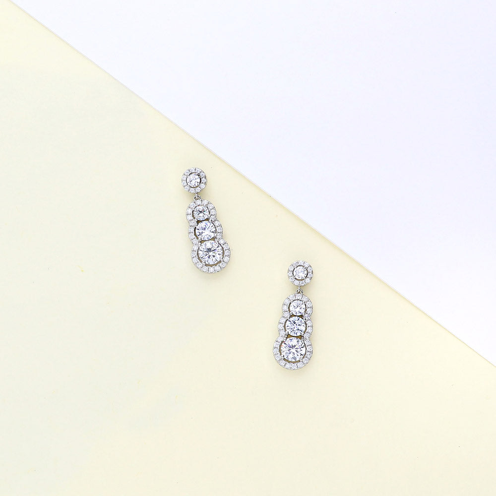 Flatlay view of Graduated Halo CZ Earrings in Sterling Silver, 5 of 7
