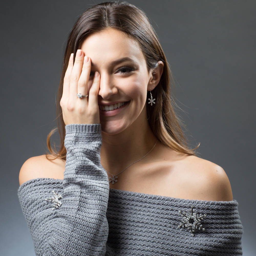 Model wearing Snowflake CZ Fish Hook Earrings in Sterling Silver, 2 of 3