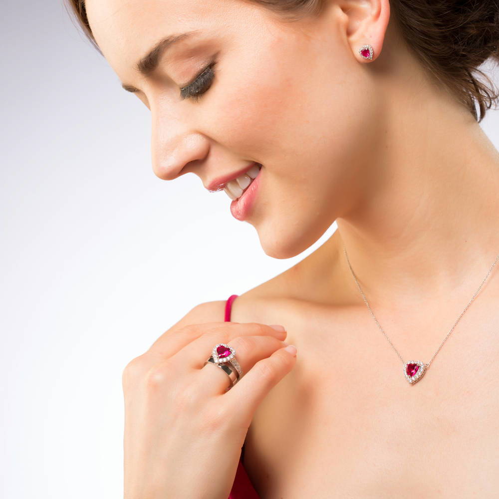 Model wearing Halo Heart Simulated Ruby Heart CZ Ring in Sterling Silver, 2 of 10