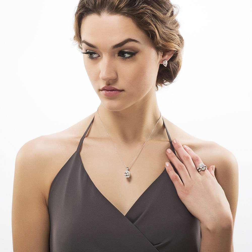 Model wearing Skull Bones CZ Necklace and Earrings Set in Sterling Silver