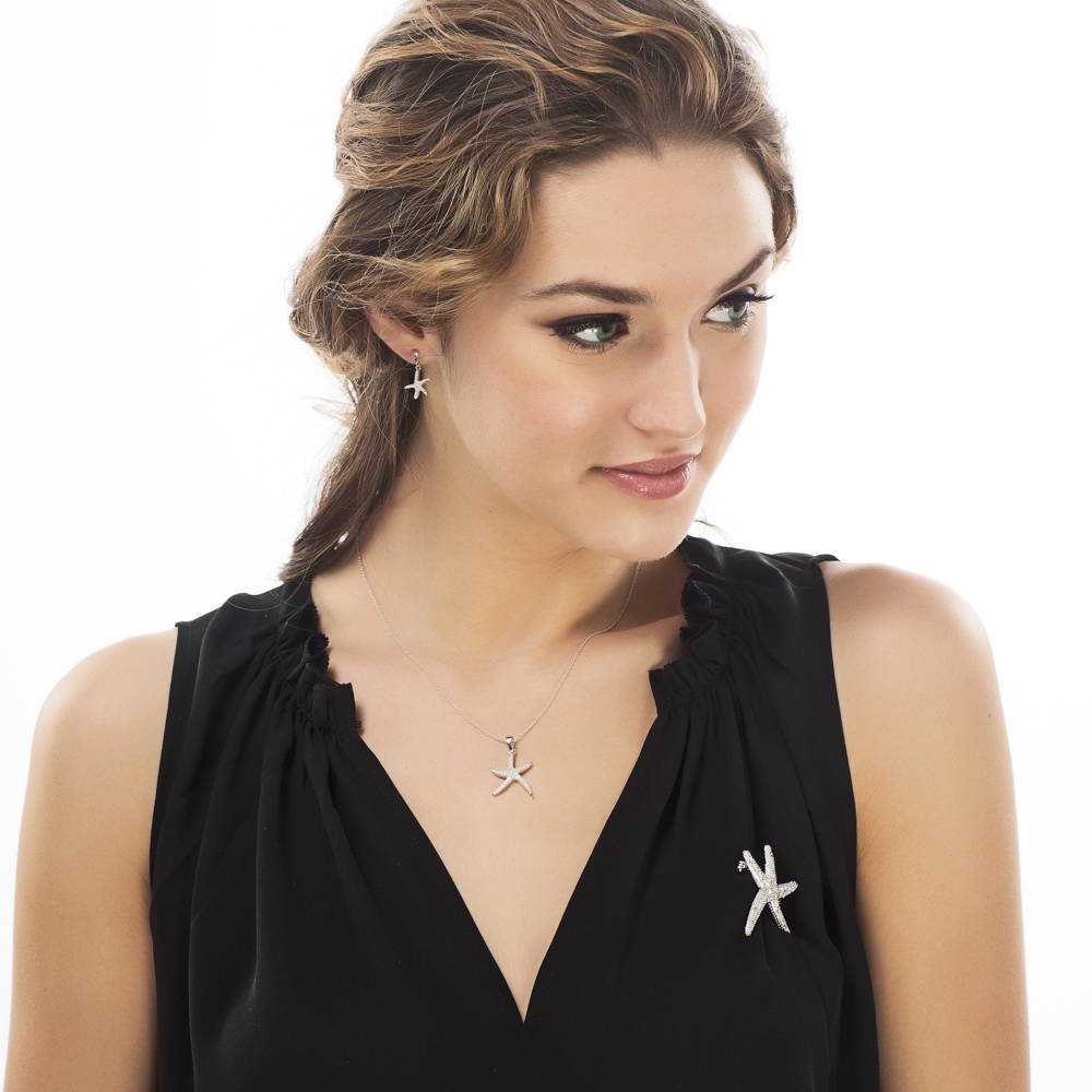 Model wearing Starfish CZ Dangle Earrings in Sterling Silver, 3 of 4