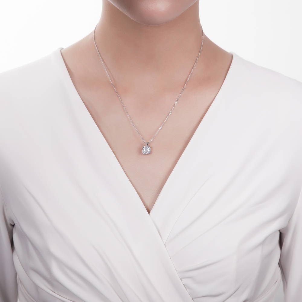 Model wearing Solitaire Asscher CZ Necklace and Earrings Set in Sterling Silver