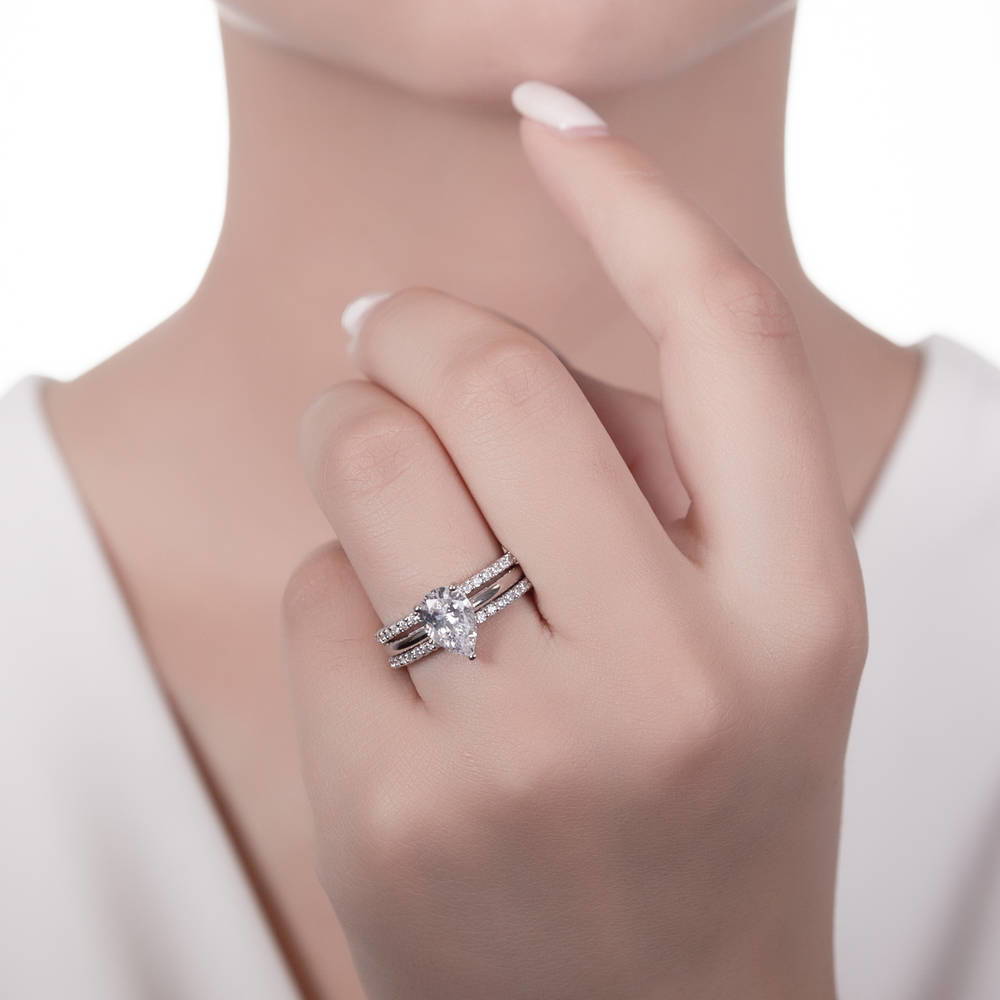 Model wearing Solitaire 1.8ct Pear CZ Ring Set in Sterling Silver, 2 of 17