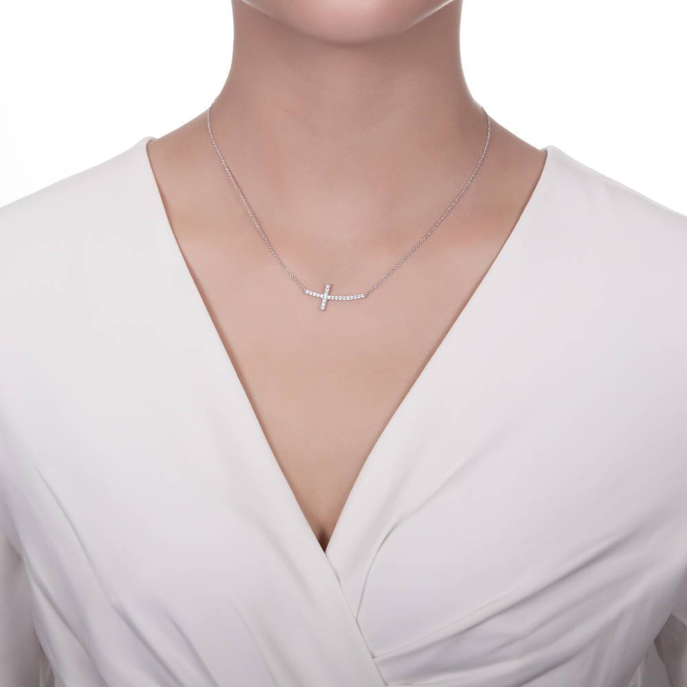 Model wearing Sideways Cross CZ Pendant Necklace in Sterling Silver, 5 of 9