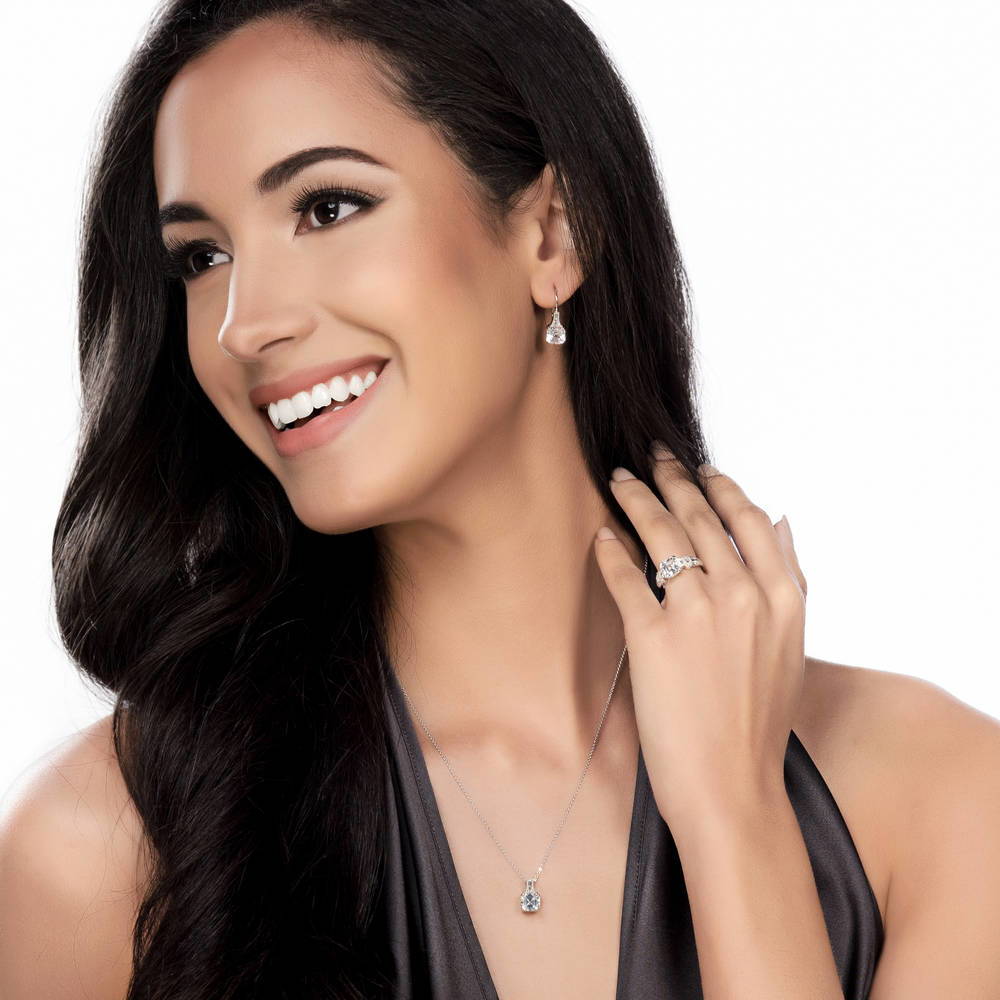 Model wearing Solitaire 4ct Asscher CZ Leverback Earrings in Sterling Silver, 2 of 4