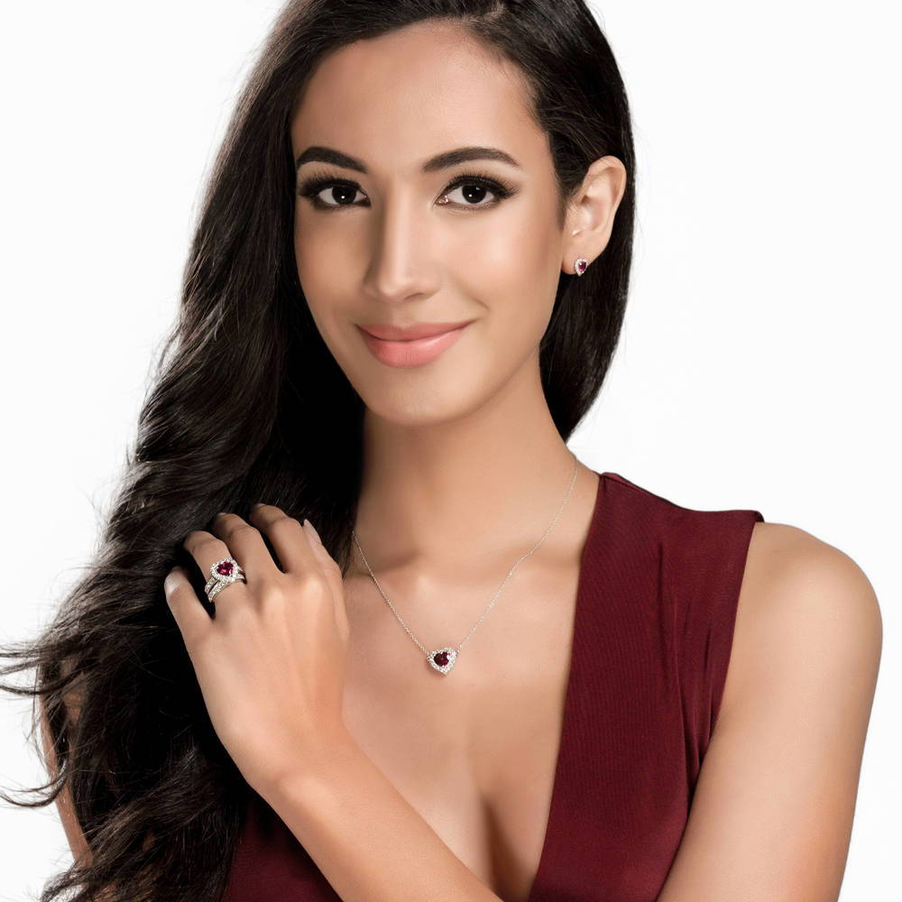 Model wearing Halo Heart Simulated Ruby CZ Statement Ring Set in Sterling Silver, 2 of 10