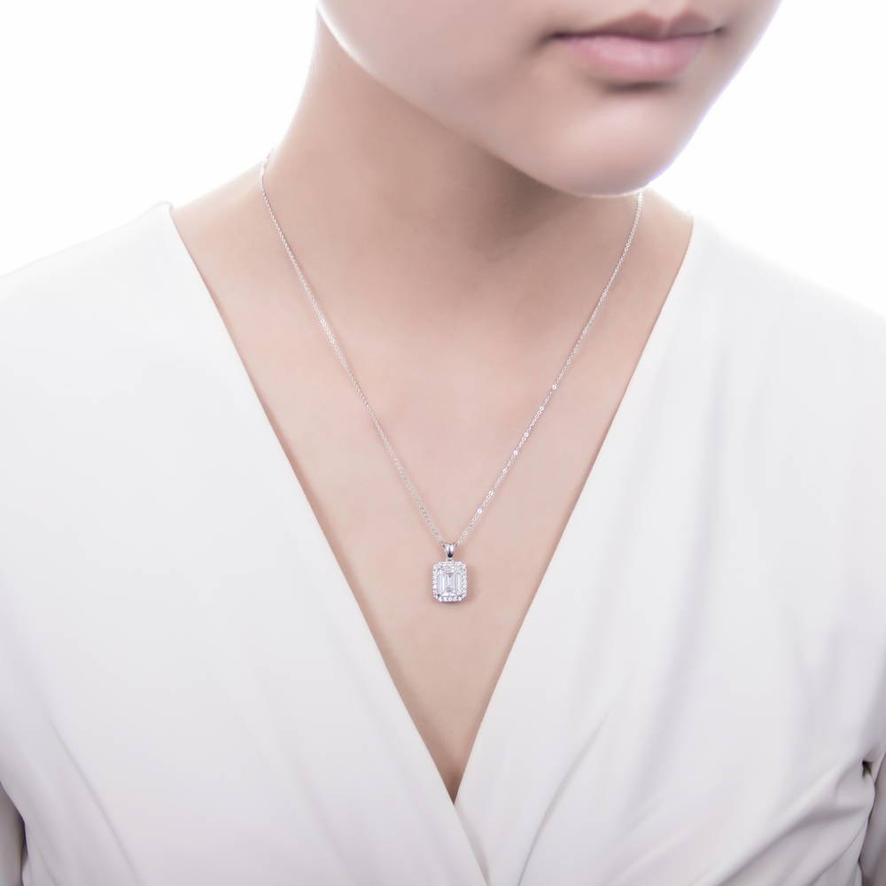 Model wearing Halo Emerald Cut CZ Necklace and Earrings Set in Sterling Silver