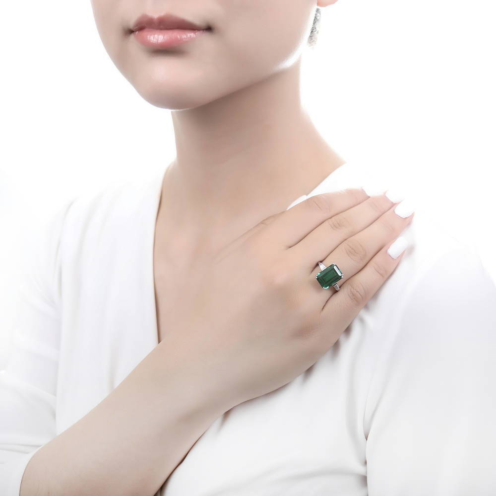 Model wearing Solitaire Simulated Emerald CZ Statement Ring in Sterling Silver 8.5ct, 2 of 10