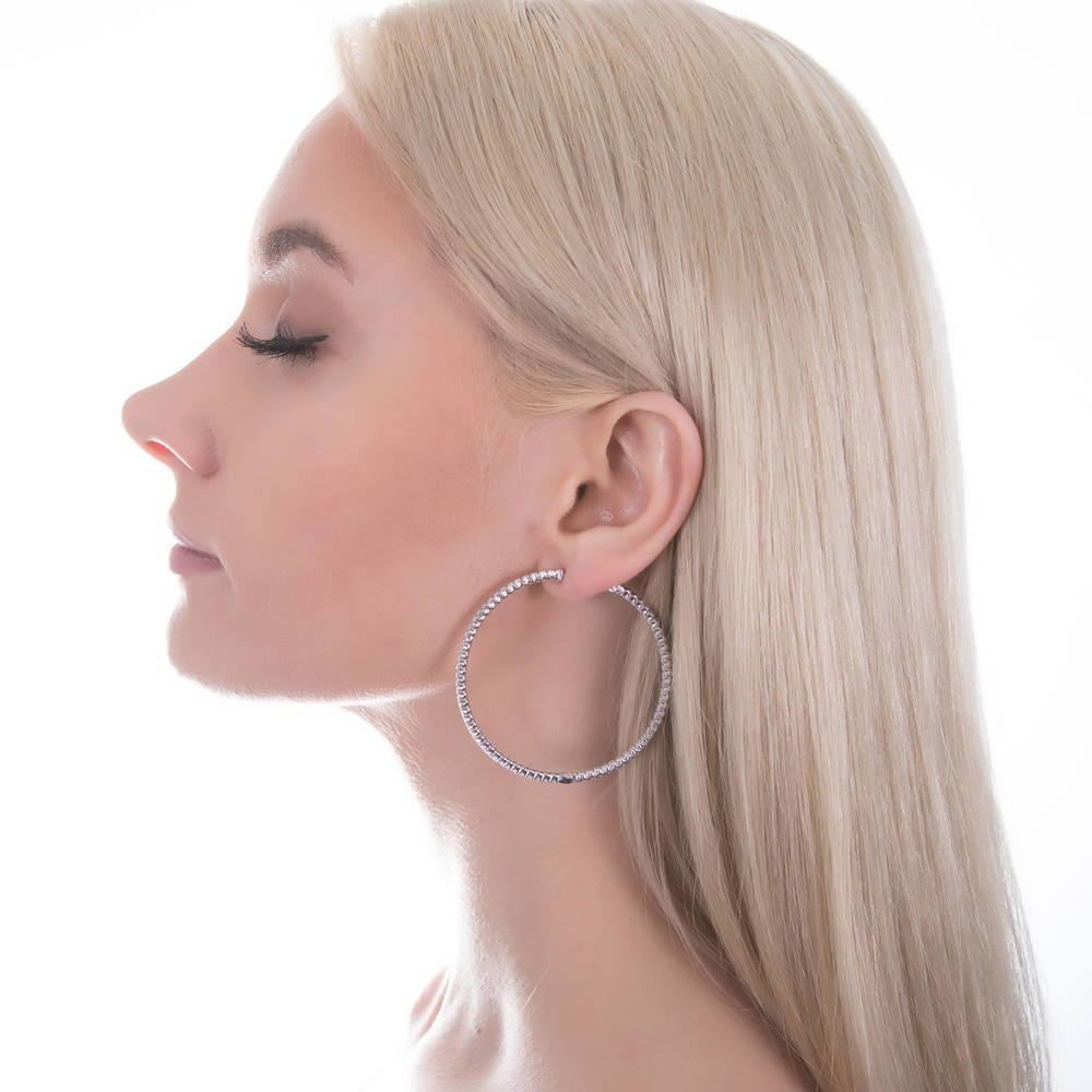 Model wearing CZ Large Inside-Out Hoop Earrings in Sterling Silver 2.2 inch, 12 of 15