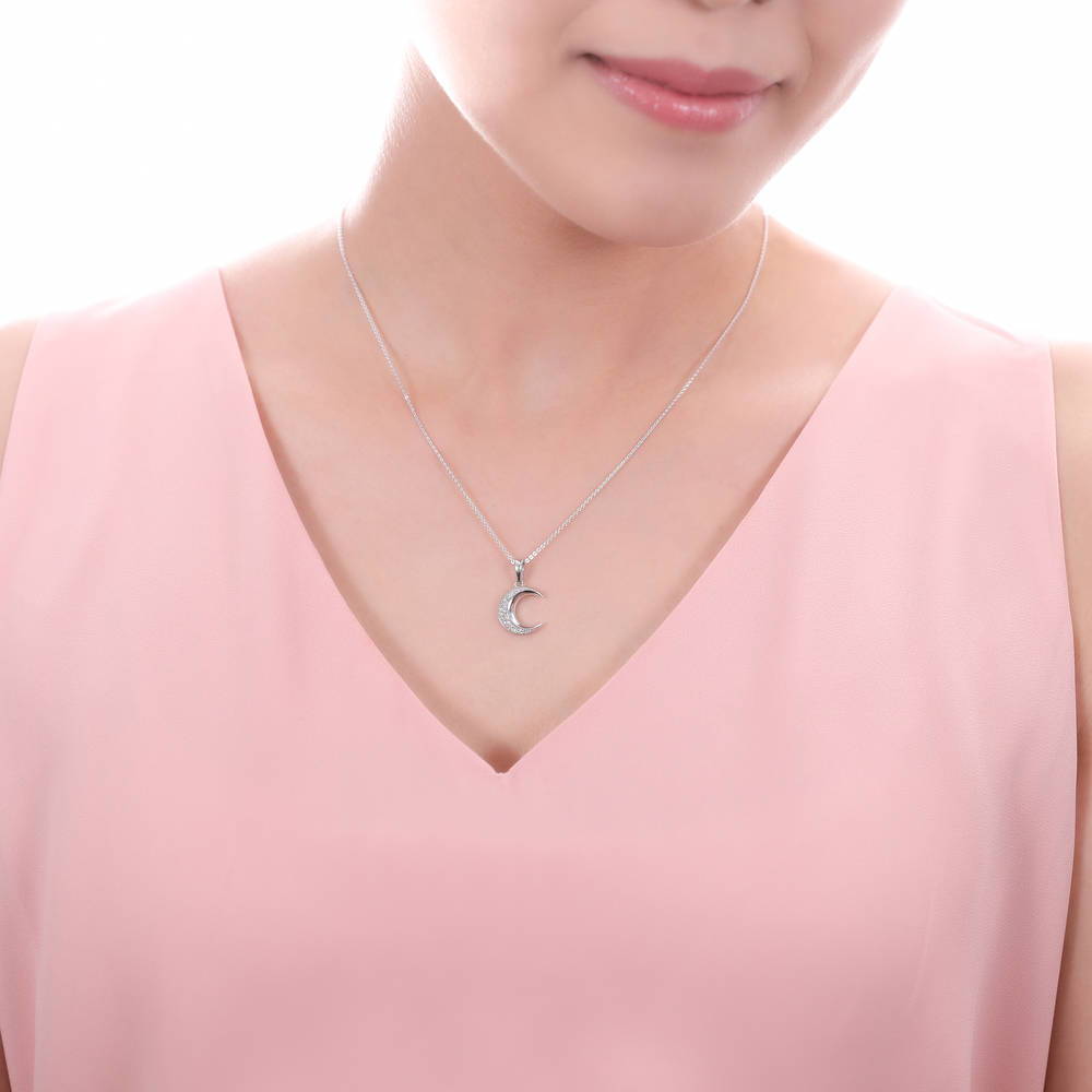 Model wearing Crescent Moon CZ Pendant Necklace in Sterling Silver, 6 of 9